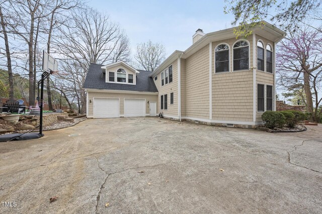 104 Sierra Dr, Chapel Hill, NC 27514 - view of front of property featuring a chimney, concrete driveway, and a shingled roof