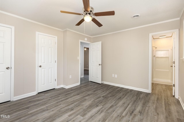 unfurnished bedroom with ceiling fan, baseboards, crown molding, and wood finished floors