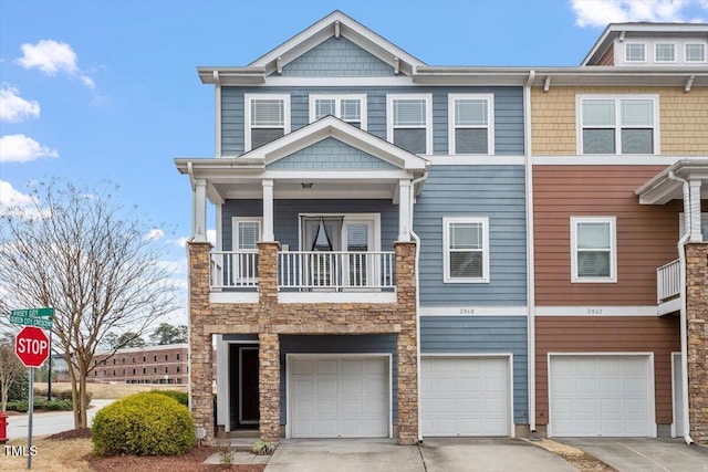 view of property with an attached garage and driveway