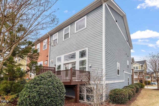 back of property featuring a wooden deck