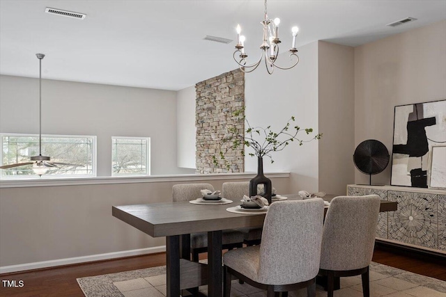 dining area featuring visible vents, ceiling fan, and wood finished floors