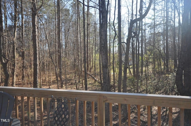 deck with a wooded view