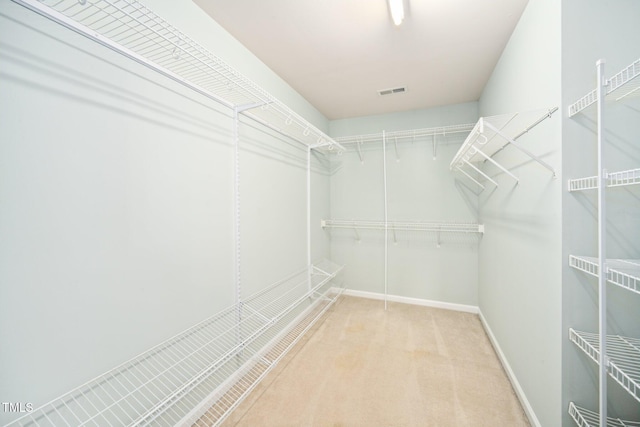 walk in closet with carpet floors and visible vents