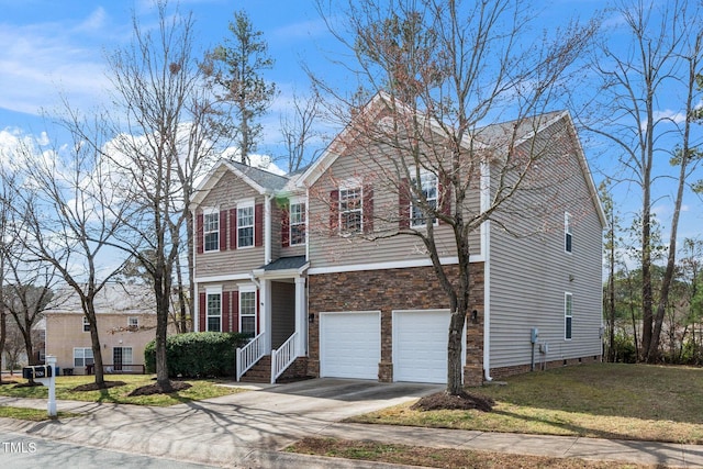 traditional-style home featuring a garage, stone siding, a front lawn, and concrete driveway