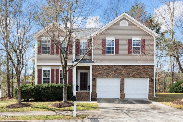 view of front of property with stone siding, concrete driveway, and an attached garage