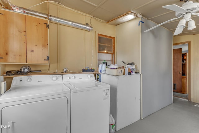 laundry area featuring cabinet space, ceiling fan, and washer and clothes dryer