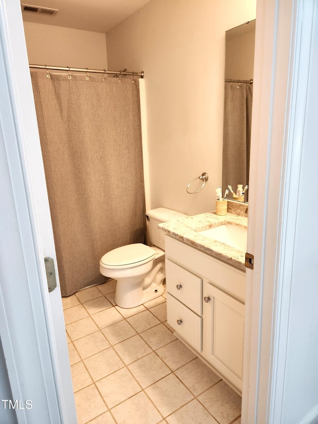 155 Georgetown Woods Dr, Youngsville, NC 27596 - full bathroom with tile patterned floors, visible vents, toilet, and vanity