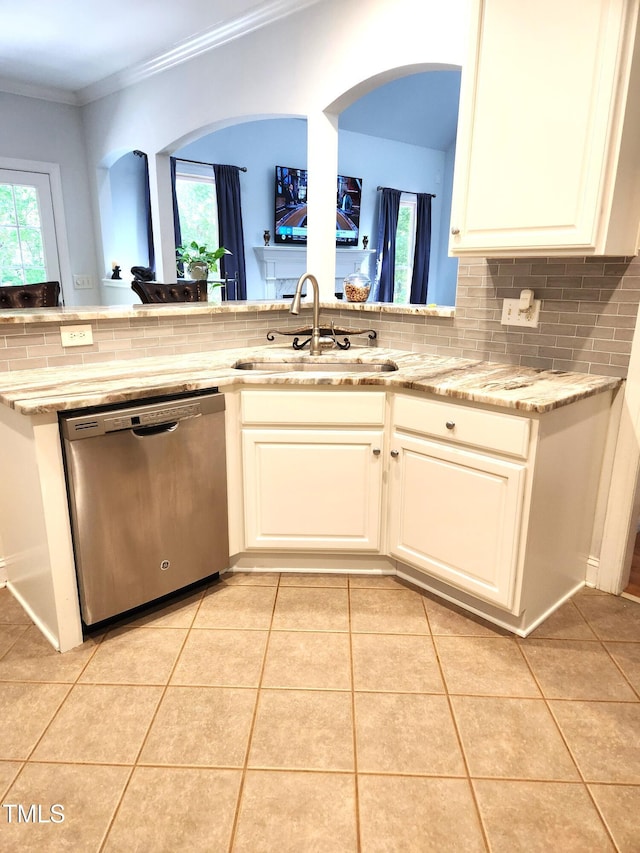 155 Georgetown Woods Dr, Youngsville, NC 27596 - kitchen featuring light tile patterned floors, ornamental molding, backsplash, dishwasher, and a sink