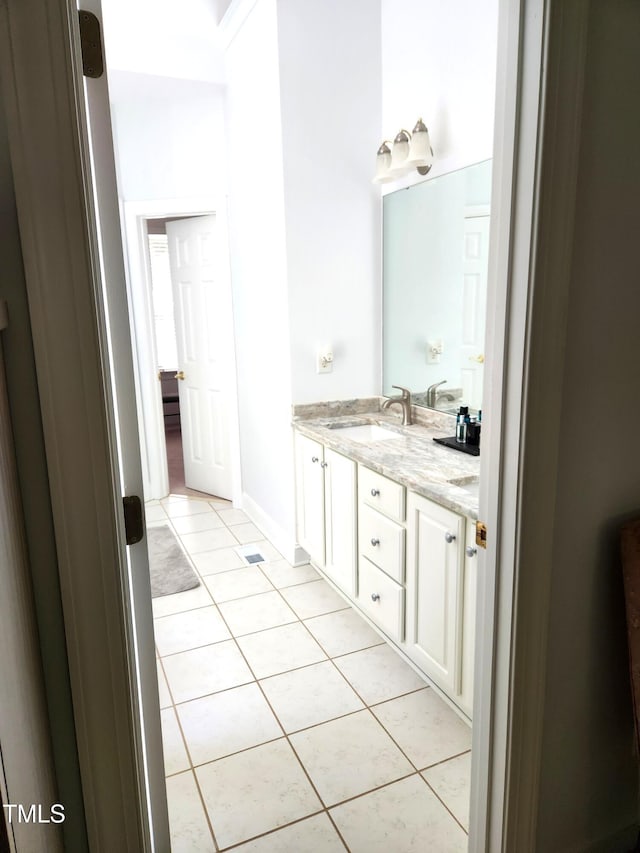 155 Georgetown Woods Dr, Youngsville, NC 27596 - bathroom featuring tile patterned flooring, double vanity, and a sink