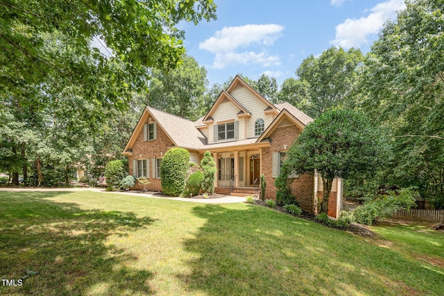155 Georgetown Woods Dr, Youngsville, NC 27596 - traditional-style house featuring brick siding and a shingled roof