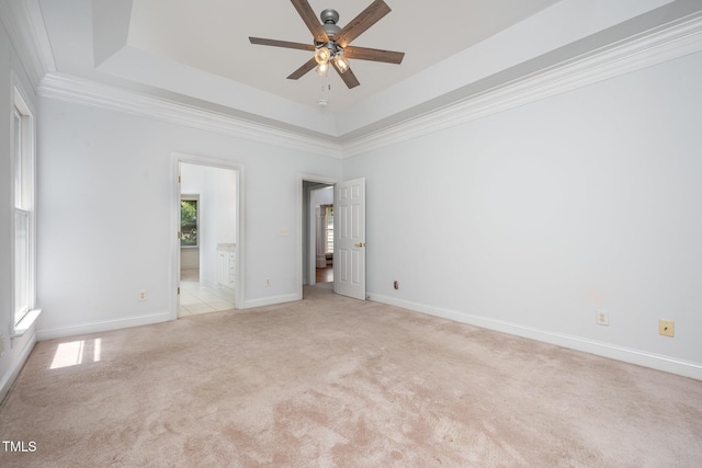 155 Georgetown Woods Dr, Youngsville, NC 27596 - unfurnished bedroom featuring light colored carpet, a tray ceiling, crown molding, and connected bathroom