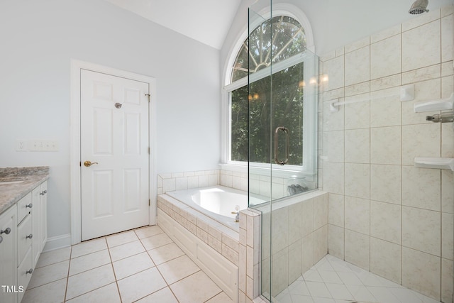 155 Georgetown Woods Dr, Youngsville, NC 27596 - full bathroom with a stall shower, a garden tub, vanity, tile patterned floors, and vaulted ceiling