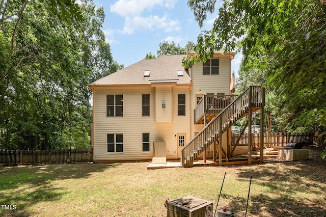 155 Georgetown Woods Dr, Youngsville, NC 27596 - rear view of property with a fenced backyard, stairway, a wooden deck, and roof with shingles