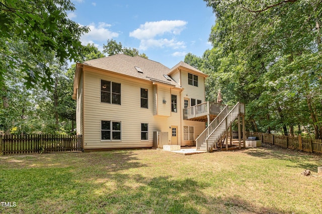 155 Georgetown Woods Dr, Youngsville, NC 27596 - rear view of house with stairs, a fenced backyard, and a deck
