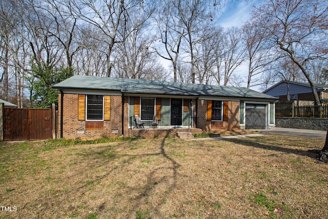 single story home with a garage, crawl space, fence, a front lawn, and brick siding