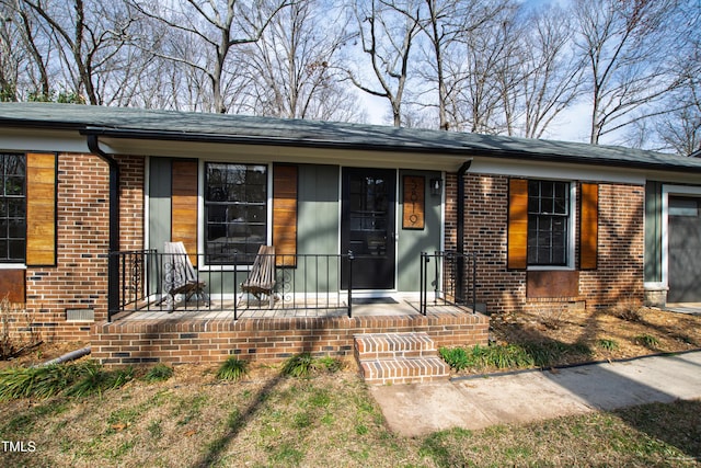 view of front of home featuring brick siding