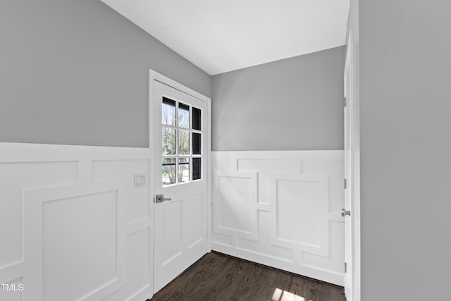 entryway featuring dark wood-style flooring and wainscoting