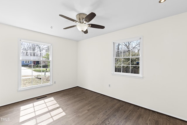 empty room featuring baseboards, visible vents, a ceiling fan, wood finished floors, and recessed lighting