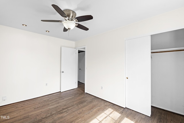 unfurnished bedroom featuring a closet, ceiling fan, and wood finished floors