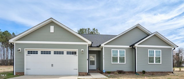 single story home with an attached garage and driveway