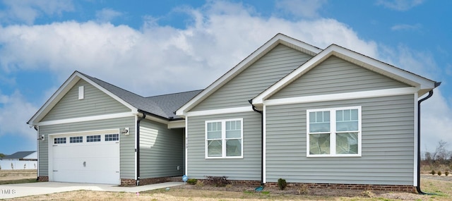 view of front of home featuring a garage and driveway