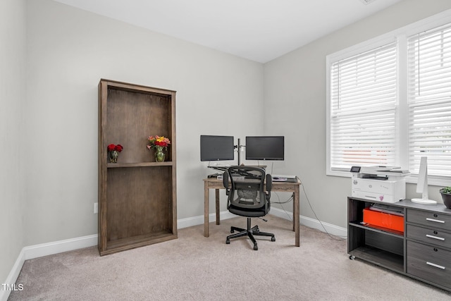 carpeted office with baseboards