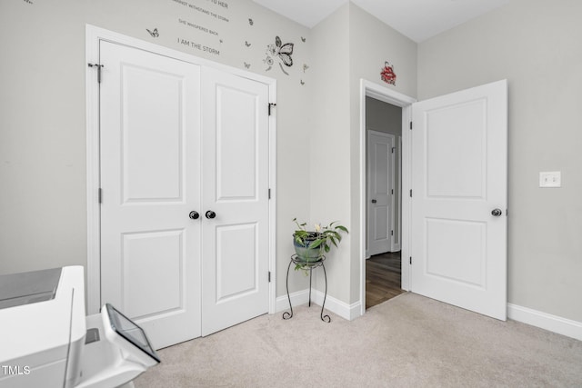 bedroom featuring carpet floors, a closet, and baseboards