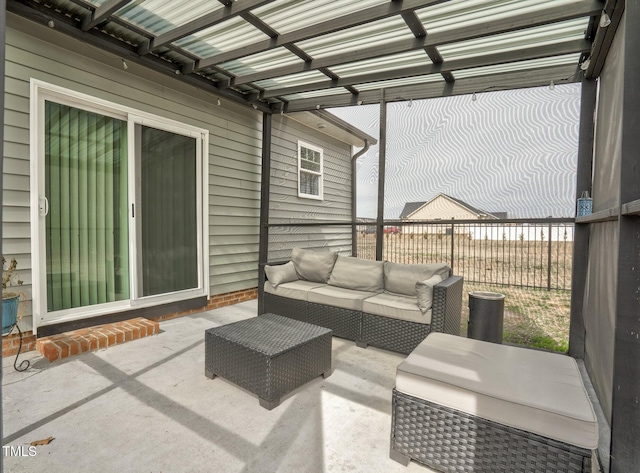 view of patio / terrace featuring an outdoor hangout area and fence