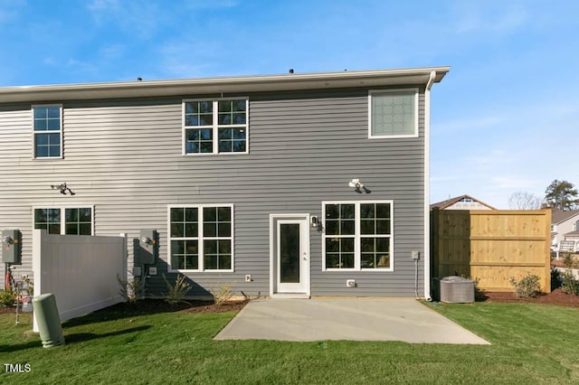 back of house with a patio, a yard, and fence