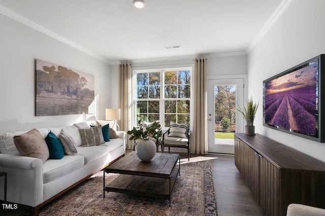 living area featuring ornamental molding, wood finished floors, and visible vents