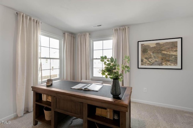 carpeted office featuring baseboards and visible vents