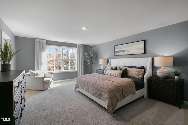 carpeted bedroom with baseboards