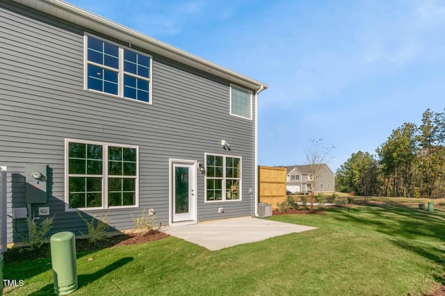 back of house featuring a patio area, a yard, and central AC unit