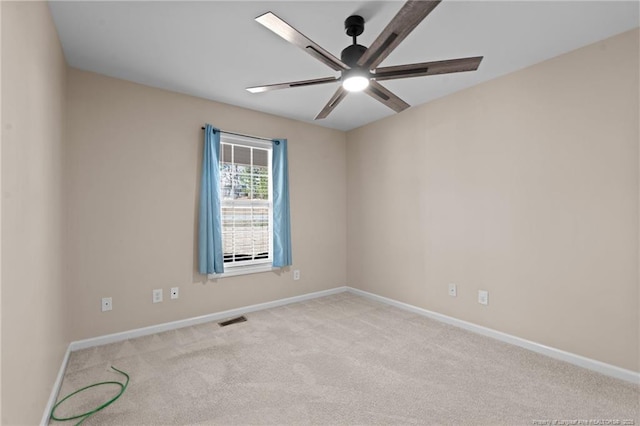 unfurnished room with baseboards, visible vents, ceiling fan, and carpet flooring