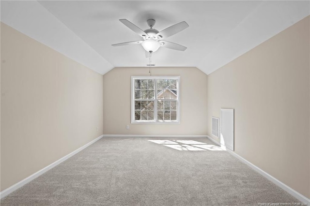 bonus room featuring lofted ceiling, baseboards, and carpet flooring