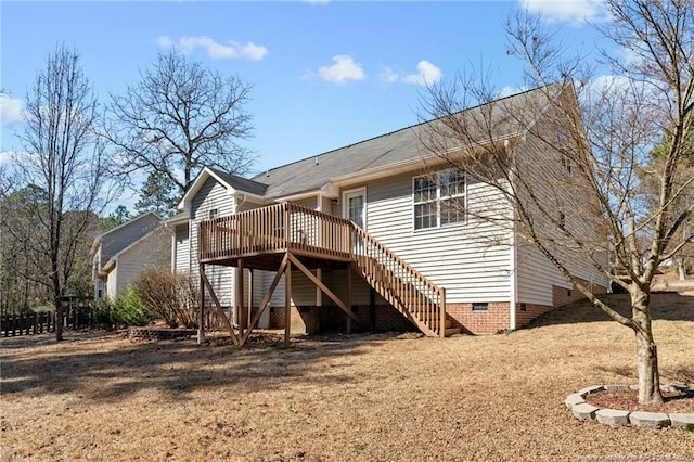 back of house with crawl space, stairway, and a wooden deck