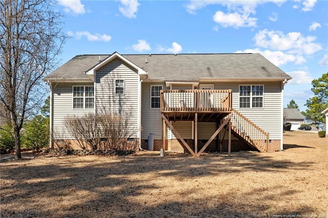 rear view of property with stairway, crawl space, cooling unit, and a wooden deck