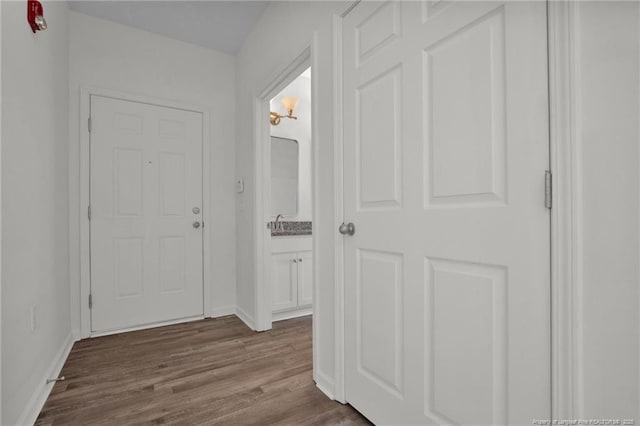 interior space with dark wood finished floors and baseboards