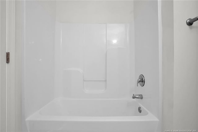 full bath featuring bathing tub / shower combination