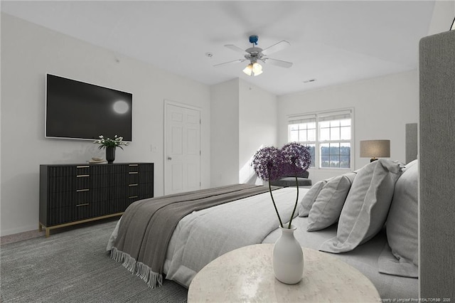 bedroom with ceiling fan and carpet flooring