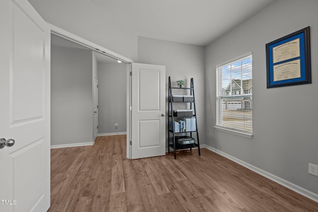 350 Arlie Ln, Lillington, NC 27546 - bedroom with light wood-style floors and baseboards