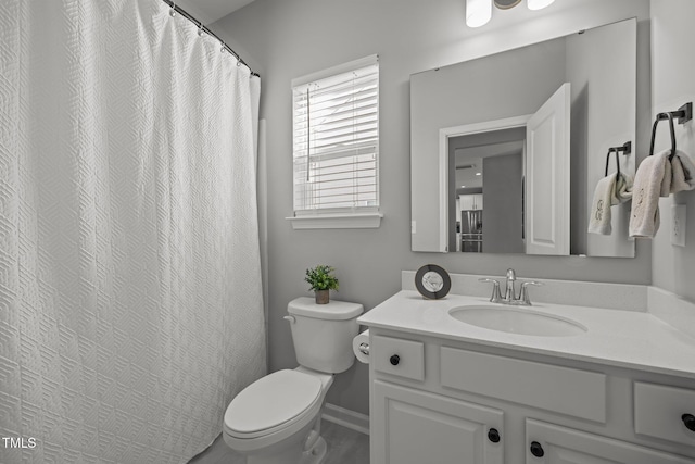 350 Arlie Ln, Lillington, NC 27546 - full bath with toilet, vanity, and baseboards