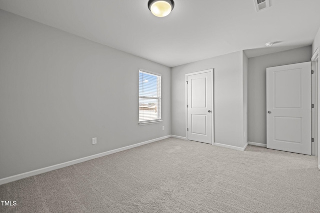 350 Arlie Ln, Lillington, NC 27546 - unfurnished bedroom featuring light carpet and baseboards