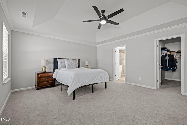350 Arlie Ln, Lillington, NC 27546 - carpeted bedroom featuring a tray ceiling, multiple windows, crown molding, and baseboards
