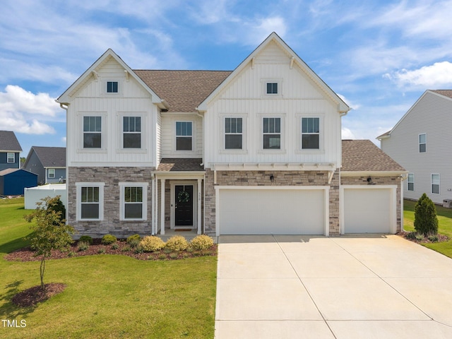 350 Arlie Ln, Lillington, NC 27546 - view of front of house with board and batten siding, concrete driveway, stone siding, a front lawn, and a shingled roof