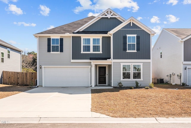 view of front of home with concrete driveway, an attached garage, fence, central air condition unit, and board and batten siding