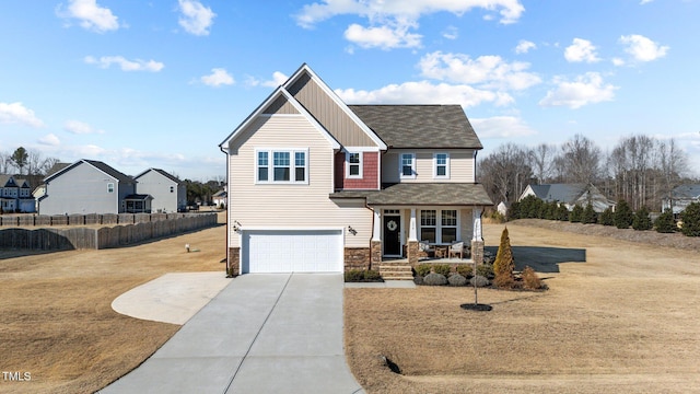 view of front facade featuring a garage, concrete driveway, a residential view, covered porch, and fence