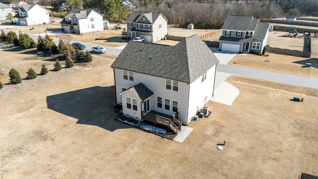 birds eye view of property with a residential view