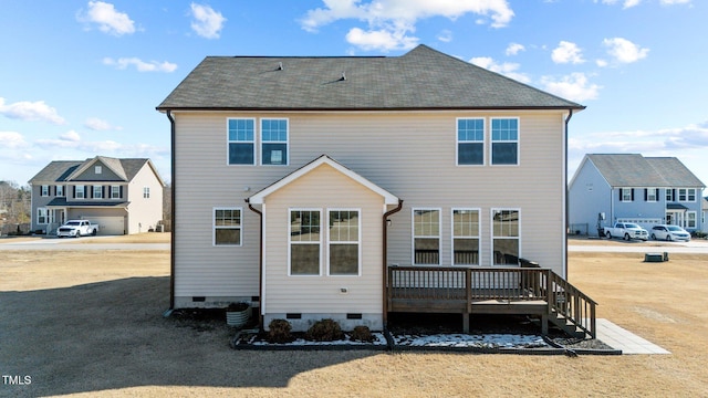 rear view of property featuring crawl space and a deck