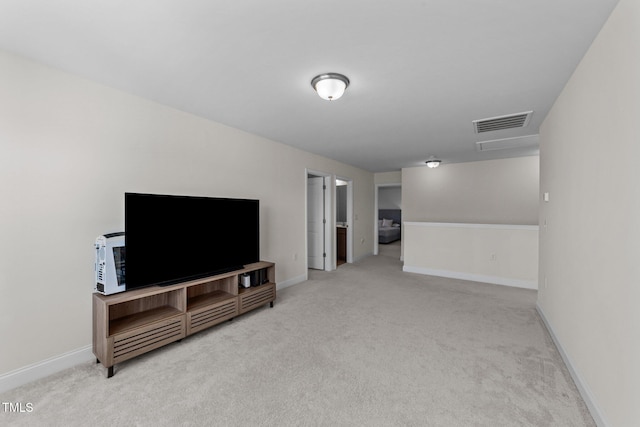 living area featuring baseboards, visible vents, and carpet flooring